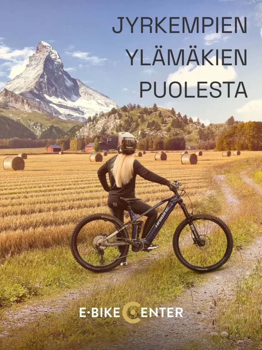 Sähköpyörä Haibike jolla nainen kiipeämässä vuoren päälle. Otsikkona Jyrkempien ylämäkien puolesta