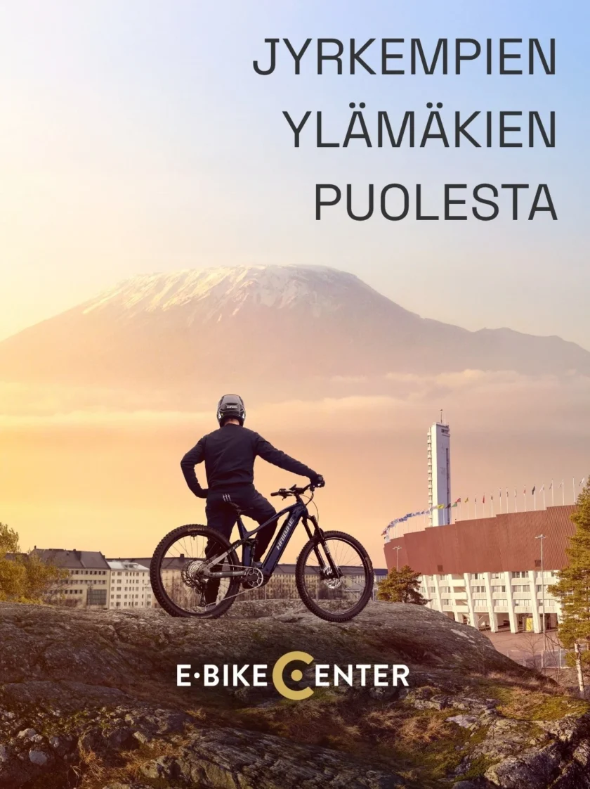 Sähköpyörä Haibike jolla Mies kiipeämässä vuoren päälle. Otsikkona Jyrkempien ylämäkien puolesta