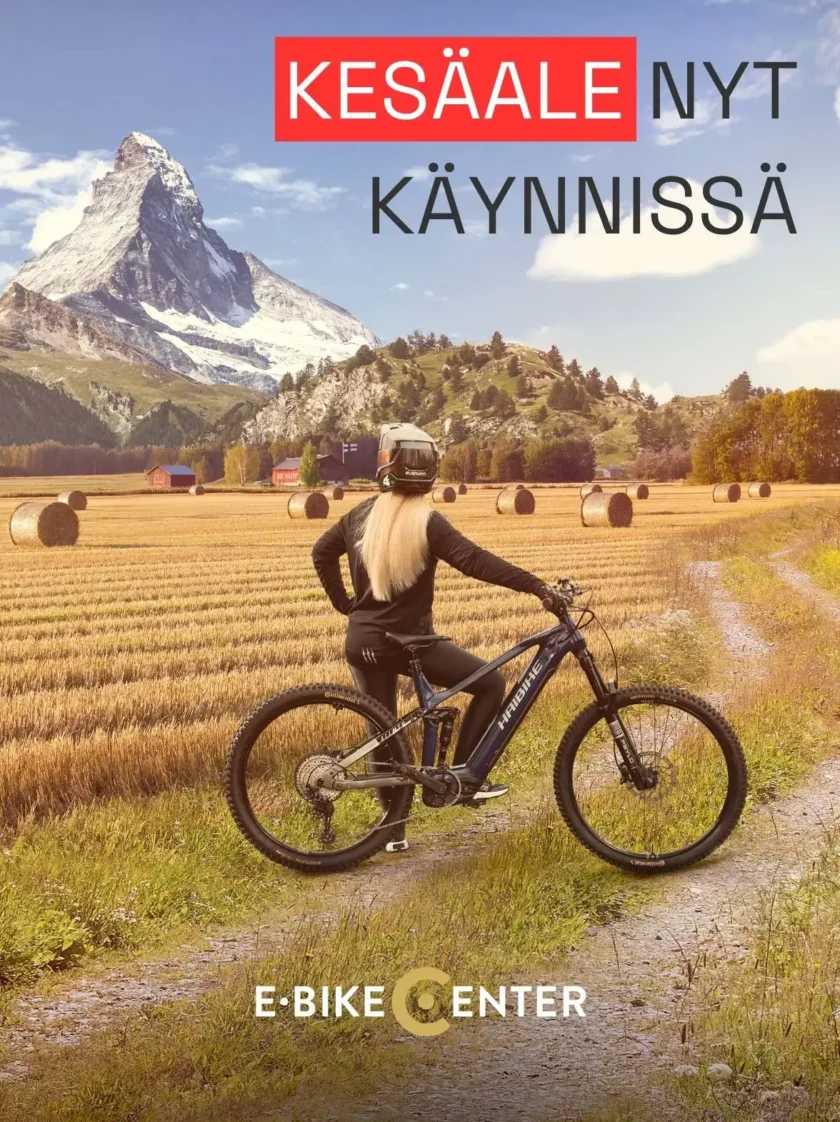 Sähköpyörä Haibike jolla nainen kiipeämässä vuoren päälle. Otsikkona Jyrkempien ylämäkien puolesta